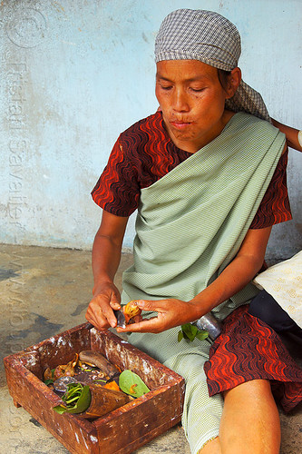 khasi woman preparing betel nut (india), areca nut, betel leaves, betel nut, betel quids, box, east khasi hills, indian woman, indigenous, knife, mawlynnong, meghalaya, preparing
