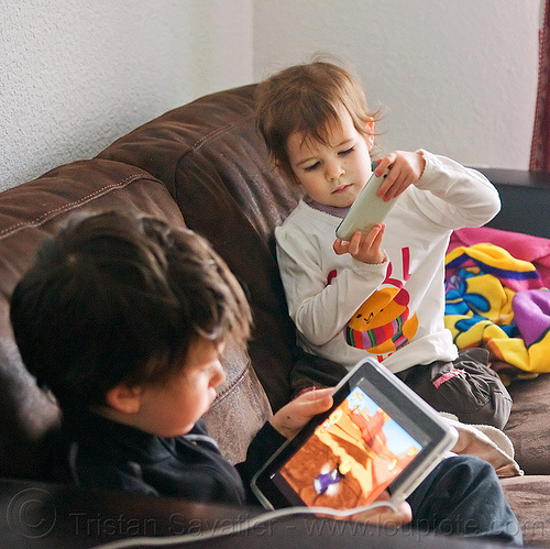 kids playing games on ipad and iphone, boy, brother, cellphone, children, coach, ipad, iphone, kids, little girl, playing, siblings, sitting, tablet computer, video game