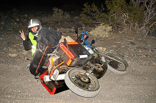 klr 650 motorbike crash, crash, dirt road, dropped, dual-sport, kawasaki, klr 650, laying down, luggage rack, mishap, motorcycle accident, motorcycle helmet, motorcycle touring, night, pannier cases, panniers, peace sign, reflective tape, sand, unpaved, v sign, victory sign, woman