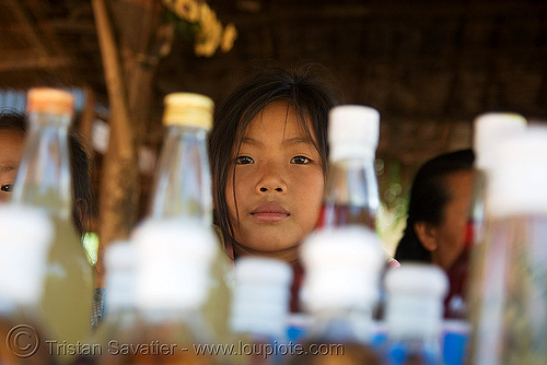 laotian girl - whisky village, near pak ou caves - luang prabang (laos), alcohol, child, kid, lao-lao, liquor, little girl, luang prabang, pak ou caves temples, rice wine, vodka, whisky village