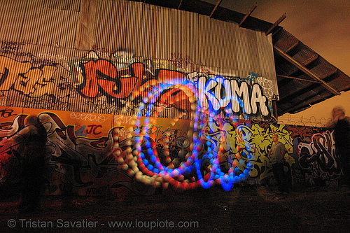 laura spinning oggz at tire beach (san francisco), glowing, graffiti, led lights, light poi, night, oggz, rave lights, spinning light