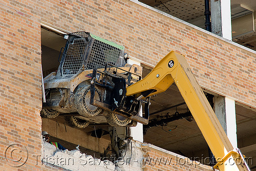 lifting caterpillar cat 226b skid steer loader with hydraulic boom - building demolition, abandoned building, abandoned hospital, at work, attachment, building demolition, cat 226b, caterpillar 226b, excavators, front loader, presidio hospital, presidio landmark apartments, skid steer loader, working