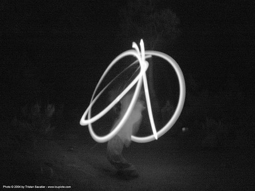 light-dancer-drawing-peace-sign - rainbow gathering - hippie, fire dancer, fire dancing, fire performer, fire poi, fire spinning, hippie, night, spinning fire