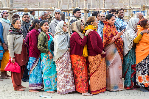 line of hindu pilgrims at temple gate, crowd, hindu pilgrimage, hinduism, indian women, kumbh mela, line, men, queue, row