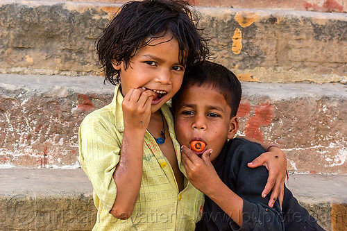 little girl with her brother - eating carrots (india), boy, brother, carrot, children, eating, hug, hugging, kids, little girl, siblings, varanasi