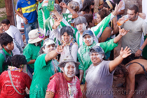 locals carnival partygoers covered with talk powder - carnaval de tilcara (argentina), andean carnival, argentina, carnaval de la quebrada, carnaval de tilcara, noroeste argentino, quebrada de humahuaca, talk powder