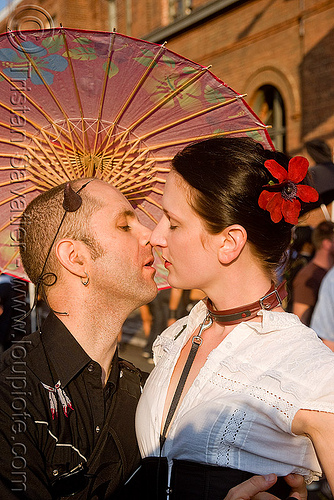 lovers and japanese umbrella - folsom street fair 2009 (san francisco), japanese umbrella, kiss, kissing, lovers, man, woman
