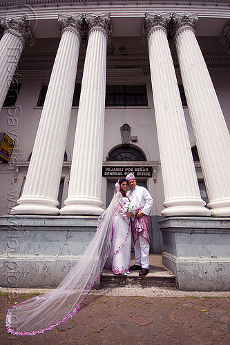 malay wedding in front of the general post office (kuching), architecture, borneo, bridal bouquet, bride, columns, groom, kuching, malay wedding, malaysia, man, post office, traditional wedding, wedding dress, white flowers, white roses, woman