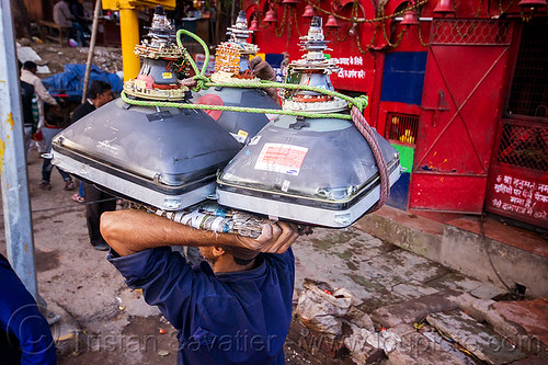 man carrying crt screens on his head (india), carrying on the head, cathodic ray tubes, crt, delhi, electronics, load bearer, man, porting, recycling, rope, television, tv screens, wallah