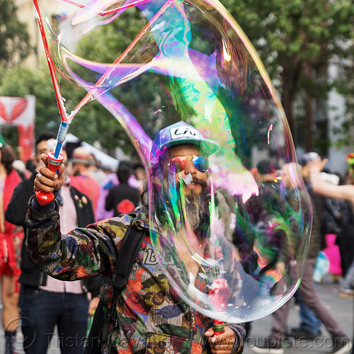 man making giant soap bubbles - how weird street faire (san francisco), giant soap bubble, iridescent, man