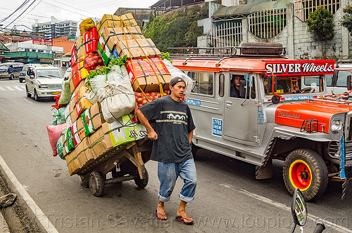 man pulling loaded hand cart on street (philippines), baguio, jeepneys, man, produce, road, rolling, truck, vegetables, worker, working