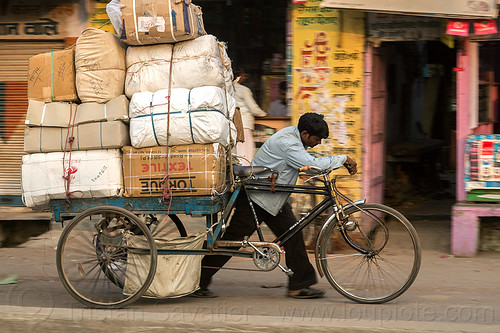 man pushing cargo tricycle with heavy load (india), bags, boxes, cargo tricycle, cargo trike, freight tricycle, freight trike, heavy, load bearer, man, moving, sacks, transport, transportation, transporting, varanasi, walking, wallah