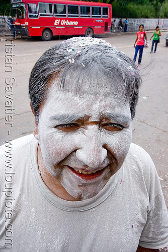 man's face covered with talk powder - white - carnaval - carnival in jujuy capital (argentina), andean carnival, argentina, carnaval de la quebrada, jujuy capital, man, noroeste argentino, san salvador de jujuy, talk powder, white