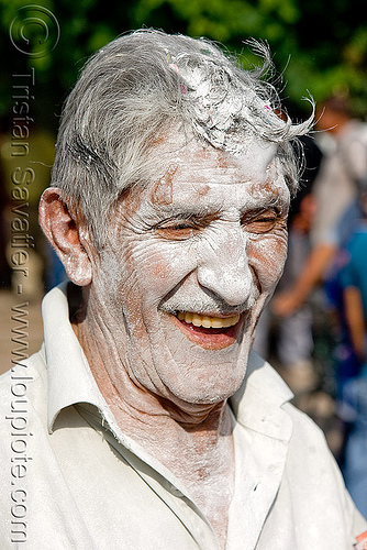 man's face covered with white talk powder - carnaval - carnival in jujuy capital (argentina), andean carnival, argentina, carnaval de la quebrada, jujuy capital, man, noroeste argentino, san salvador de jujuy, talk powder, white