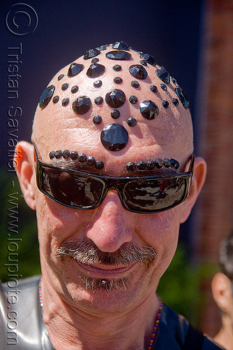 man with black bindis on head - up your alley fair, bald head, black bindis, jewelry, juan, man, scalp, shaved head, shaven head, sunglasses