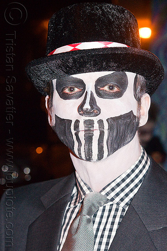 man with black & white skull makeup, black hat, black suit, checkered shirt, day of the dead, face painting, facepaint, grey tie, halloween, man, night, sugar skull makeup