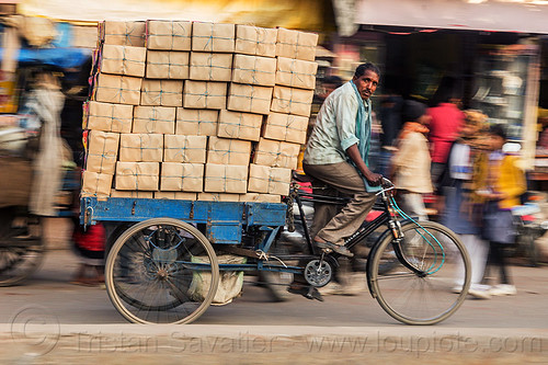 man with load of boxes on cargo tricycle (india), boxes, cargo tricycle, cargo trike, cycle rickshaw, freight tricycle, freight trike, heavy, load bearer, man, moving, riding, transport, transportation, transporting, varanasi, wallah