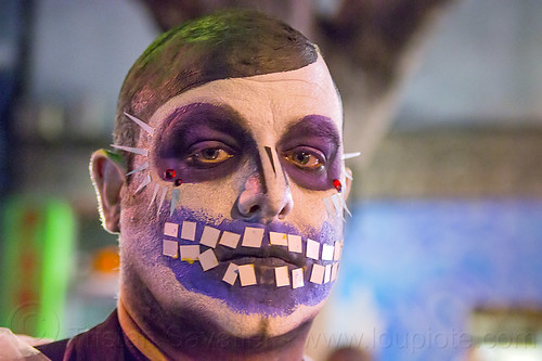 man with purple skull makeup, bindis, day of the dead, dia de los muertos, face painting, facepaint, halloween, man, night, purple, skull makeup, teeth