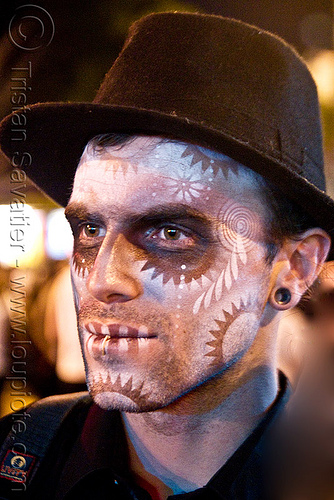 man with stencil airbrush skull makeup - dia de los muertos - halloween (san francisco), airbrush, day of the dead, dia de los muertos, face painting, facepaint, halloween, hat, icarus zaure, makeup, man, night, stencil