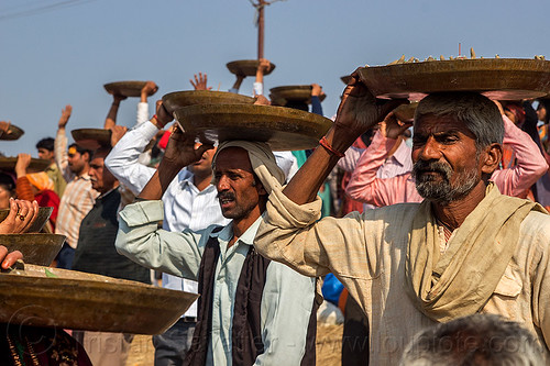 men carrying trays overhead (india), carrying on the head, clay, crowd, hindu ceremony, hindu pilgrimage, hinduism, kumbh mela, lingams, men, offerings, shiva linga, shiva lingam, shivling, trays, walking