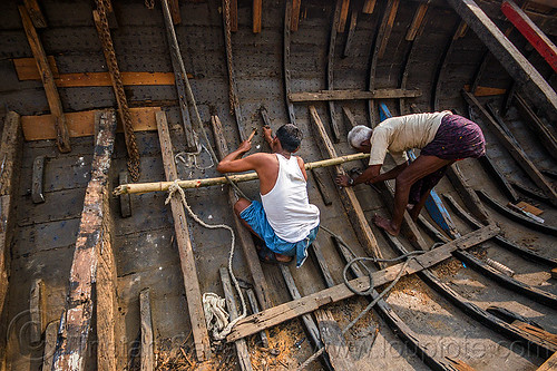 men repairing hull of wooden river boat, fixing, hull, men, repairing, river boat, varanasi, working