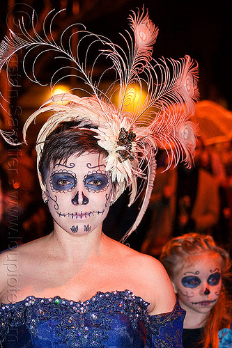 mother and daughter with sugar skull makeup - white feather headdress, blue dress, child, daughter, day of the dead, dia de los muertos, face painting, facepaint, feather headdress, girl, halloween, kid, mother, night, sugar skull makeup, white feathers