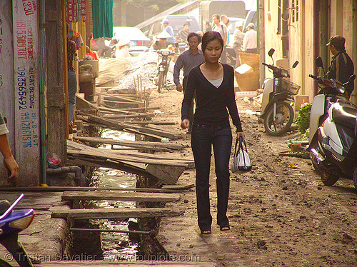 muddy street - open sewage (hanoi) - vietnam, asian woman, groundwork, hanoi, mud, muddy, road construction, roadworks