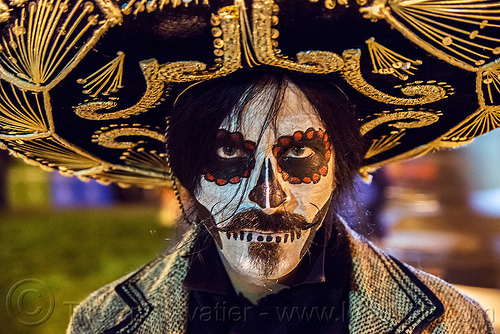 mustachioed man with dramatic sugar skull makeup - mexican sombrero - dia de los muertos, day of the dead, dia de los muertos, face painting, facepaint, goatee, halloween, hat, man, mustache, night, skull makeup, sombrero