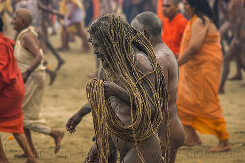 naga baba with long dreadlocks - kumbh mela (india), crowd, dreadlocks, hindu pilgrimage, hinduism, kumbh mela, men, naga babas, naga sadhus, sadhu, vasant panchami snan, walking