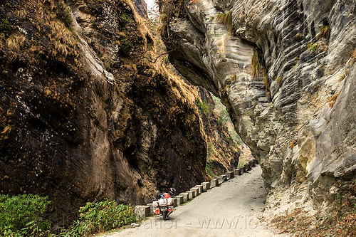 narrow gorge - overhanging rock - road between beni and jomsom (nepal), annapurnas, canyon, cliff, dirt road, gorge, kali gandaki valley, motorcycle touring, mountain road, mountains, overhanging rock, unpaved