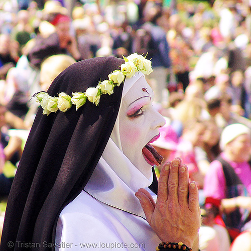 nun praying - the sisters of perpetual indulgence - easter sunday in dolores park, san francisco, drag, easter, flower crown, flowers, hands, makeup, man, nuns, praying, saint rita of cascia, sister mary timothy simplicity, sticking out tongue, sticking tongue out
