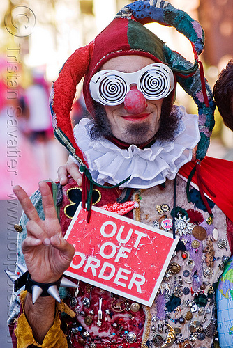 out of order clown, beard, clown nose, costume, fool hat, hand, man, out of order, peace sign, red nose, spiral glasses, spiral goggles, v sign, victory sign