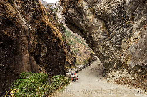 overhanging rock in narrow gorge near tatopani - road between beni and jomsom (nepal), annapurnas, canyon, cliff, dirt road, gorge, kali gandaki valley, motorcycle touring, mountain road, mountains, overhanging rock, unpaved