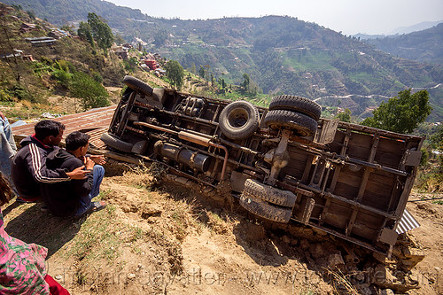 overturned truck in ditch off mountain road (nepal), crash, ditch, lorry accident, mountain road, overturned, rollover, tata motors, traffic accident, truck accident, underbelly, up-side-down, wreck