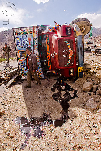 overturned truck - khardungla pass - ladakh (india), crash, environment, khardung la pass, ladakh, lorry accident, men, mountain pass, oil spill, overturned truck, pollution, road, rollover, tata motors, traffic accident, truck accident, wreck