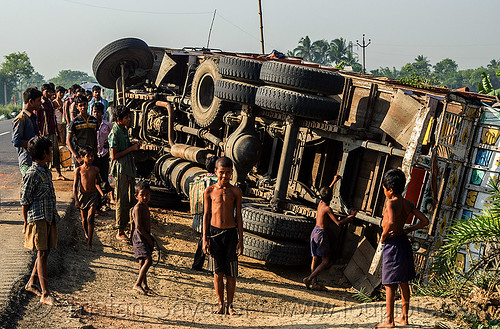 overturned truck on road side (india), boys, children, crash, crowd, kids, lorry accident, men, overturned truck, road, rollover, tata motors, traffic accident, truck accident, underbelly, wreck
