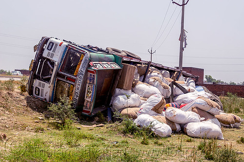 overturned truck with spilled load (india), 2515 cex, cargo, crash, freight, load, lorry accident, overturned, road, rollover, sacks, spilled, tata motors, traffic accident, truck accident, wreck