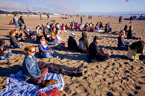 people meditating on beach during solar eclipse (san francisco), crowd, man, meditating, meditation, ocean beach, sand, sitting, solar eclipse