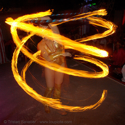 performer spinning fire hula hoop - spiral (san francisco), bohemian carnival, fire dancer, fire dancing, fire hula hoop, fire performer, fire spinning, hula hooping, night, spinning fire, spiral