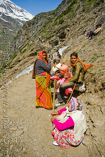 pilgrims resting on trail - amarnath yatra (pilgrimage) - kashmir, amarnath yatra, hiking canes, hindu pilgrimage, kashmir, mountain trail, mountains, pilgrims, resting, walking sticks
