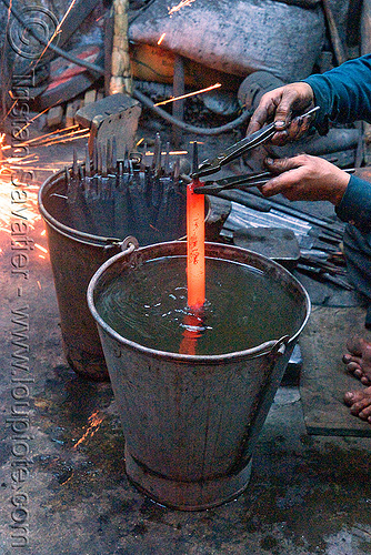 quench hardening in blacksmith workshop (delhi), blacksmith, buckets, delhi, file tools, ironwork, metal bucket, metalwork, metalworking, quench hardening, quenching process, rasp tools, red hot, water bucket, wood files, workshop