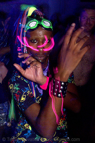 raver with el-wire through septum piercing, african american man, black man, glowing, led lights, lightshow, night, rave lights, raver outfits