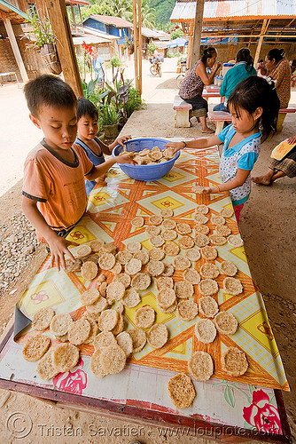 rice cookies - home made - kids - laos, boy, children, girl, kids, rice cakes, rice cookies, street market, street seller, street vendor, table