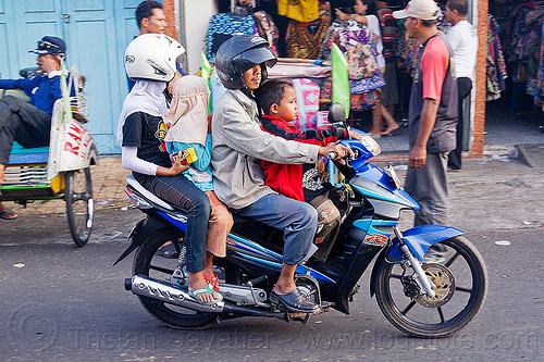 riding a motorbike in indonesia, boy, children, girl, kids, man, motorcycle helmet, rider, riding, underbone motorcycle, woman