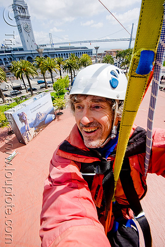 riding the zip-line over san francisco, adventure, cable line, cables, campanil, climbing helmet, clock tower, embarcadero, hanging, man, mountaineering, self portrait, sling, steel cable, strap, trolley, tyrolienne, urban, zip line, zip wire