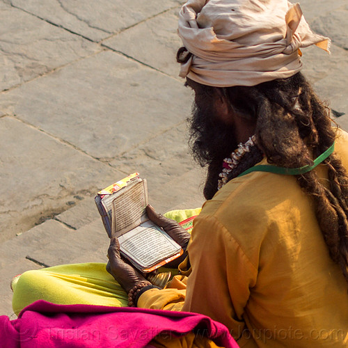 sadhu (hindu holy man) reading small book (india), baba, dreadlocks, ghats, headwear, hindi, hindu, hinduism, holy book, man, reading, sadhu, scriptures, sitting, varanasi