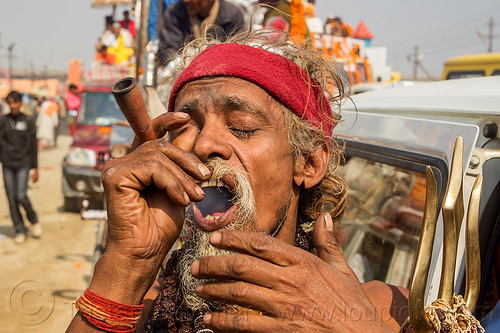 sadhu smoking ganja chillum - kumbh mela (india), baba smoking chillum, beard, chillum pipe, ganja, hindu pilgrimage, hinduism, kumbh maha snan, kumbh mela, man, mauni amavasya, sadhu, smoking pipe, smoking weed, trident