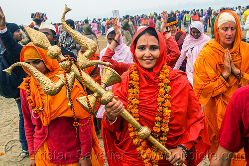 sadhvi (female hindu sadhu) at the kumbh mela 2013 (india), bhagwa, crowd, hindu pilgrimage, hinduism, indian woman, kumbh mela, man, saffron color, trident, vasant panchami snan