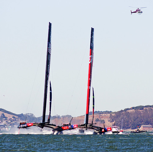 sailing hydrofoil catamarans - neck and neck, ac72, america's cup, bay, boats, emirates team new zealand, fast, foiling, helicopter, hydrofoil catamarans, hydrofoiling, ocean, oracle team usa, race, racing, sailboat, sailing hydrofoils, sea, ships, speed