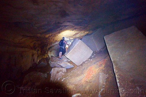 scrambling around big blocks - caving in mulu (borneo), blocks, borneo, cavers, caving, clearwater cave system, clearwater connection, gunung mulu national park, malaysia, natural cave, spelunkers, spelunking